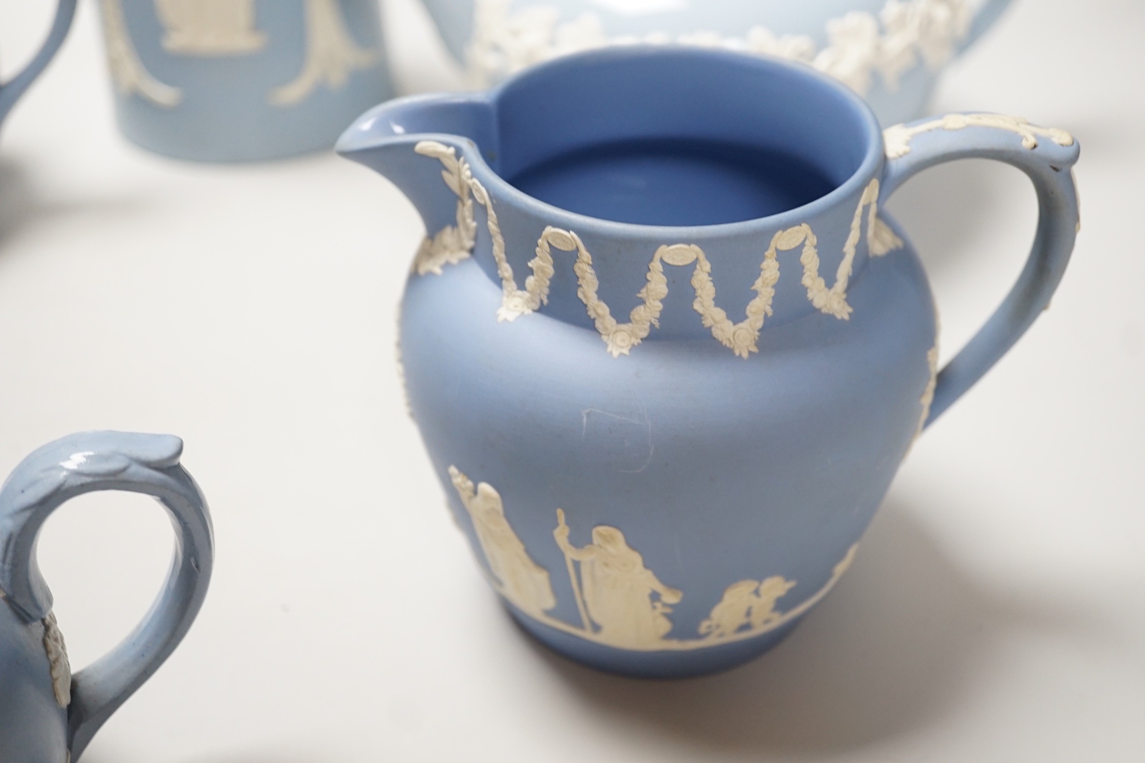A group of Wedgwood and Wedgwood-style jasperware teapots and jugs.